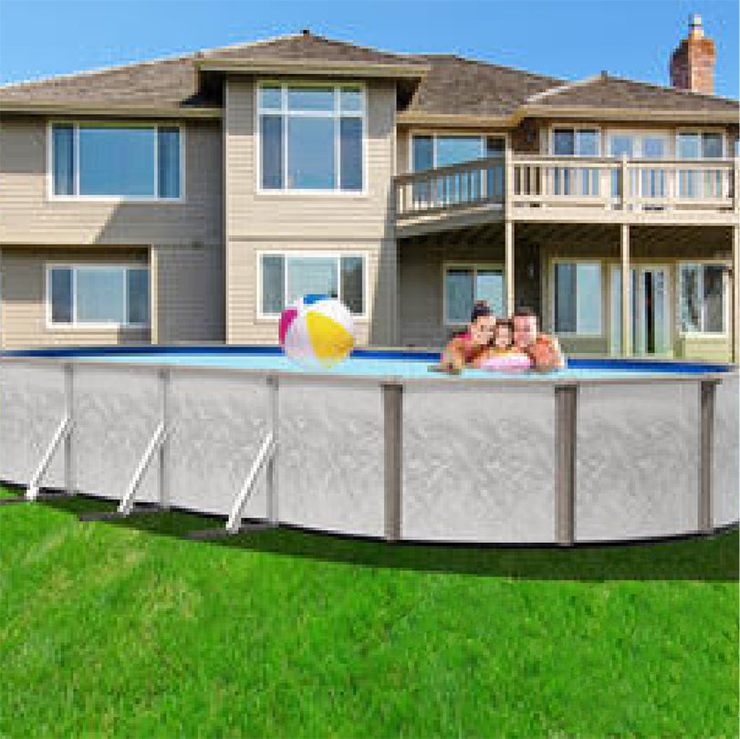 A family of three enjoys a beach ball in the SPD 18' x 33' x 52" Freedom Resin Frame Salt Oval Pool, set up on the lawn. Its corrosion-resistant frame promises lasting summer fun.