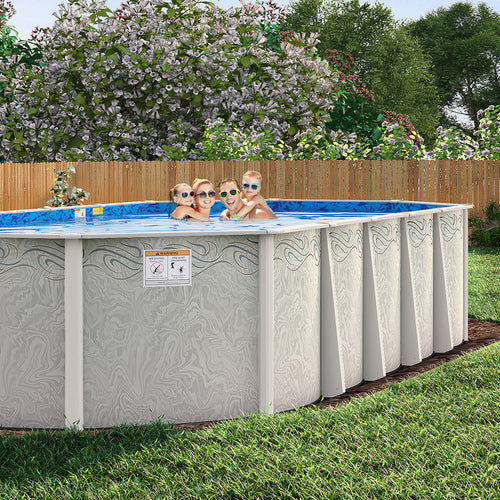 Four kids in sunglasses swim and smile in a backyard H.I.I. Embassy 16' x 32' Round Silver Interlude Semi In-Ground Pool Package with a 54" wall, framed by grass and trees. A warning label appears on the pool’s side.