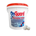 A white bucket with a red lid labeled SPD On Guard 1" Chlorine Tablets sits beside three slow-dissolving chlorine tablets. The container displays product information and safety warnings.