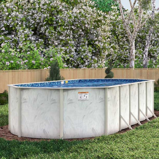 An 8' x 12' Coastal 5" Steel Frame BRACED Oval Pool & Bundle by H.I.I. Embassy stands in a grassy backyard bordered by a wooden fence, trees, and lush foliage, featuring corrosion resistance and a salt-friendly frame.