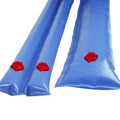 Two long blue SPD 8 ft. to 10 ft. water bags with red screw caps and no-leak valves lie side by side on a white background.