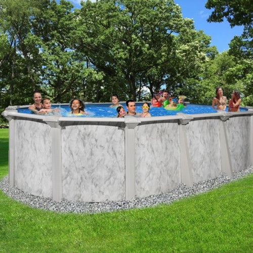 A group, including kids and adults, enjoys the H.I.I. Embassy 12' x 24' x 54" Sea Shore Hybrid Oval Pool with sturdy 7" resin rails, set on green grass among trees under a sunny sky.